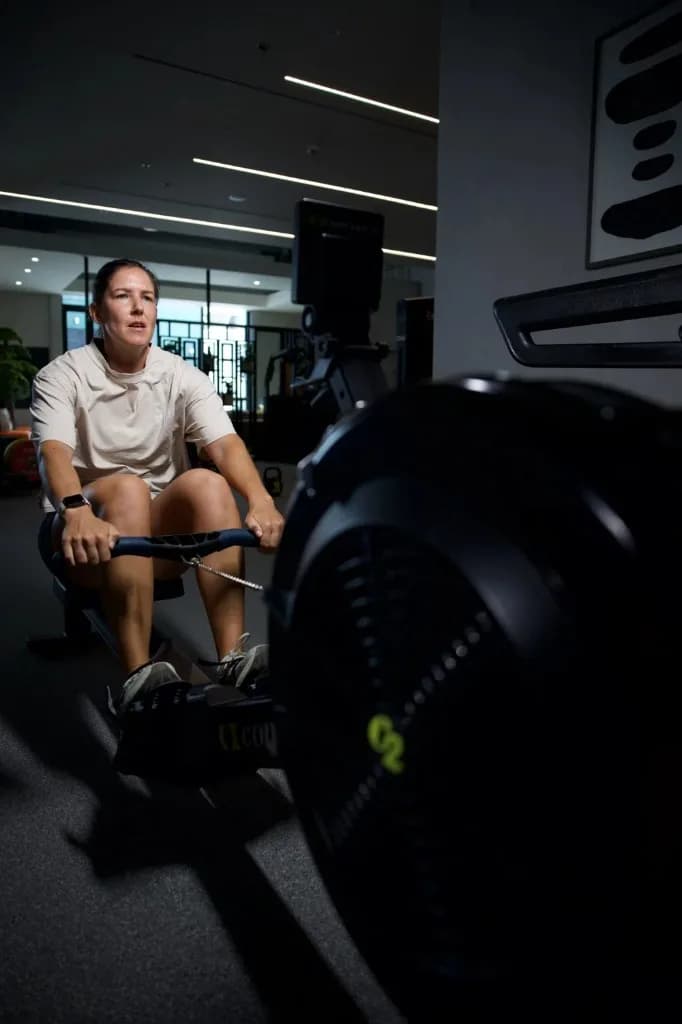 Athlete rowing during HYROX race preparation