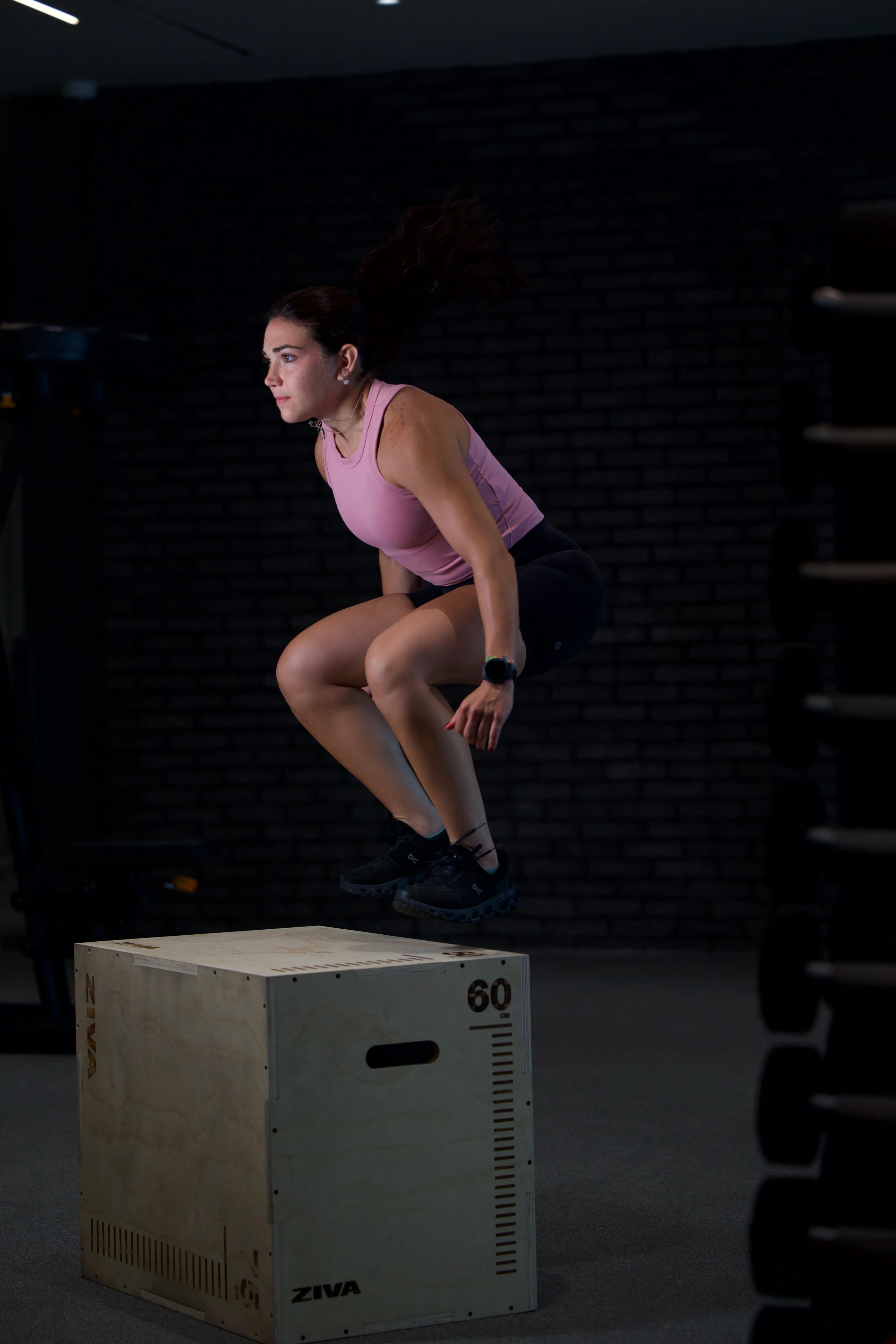 Everybody athlete jumping onto a box during race preparation